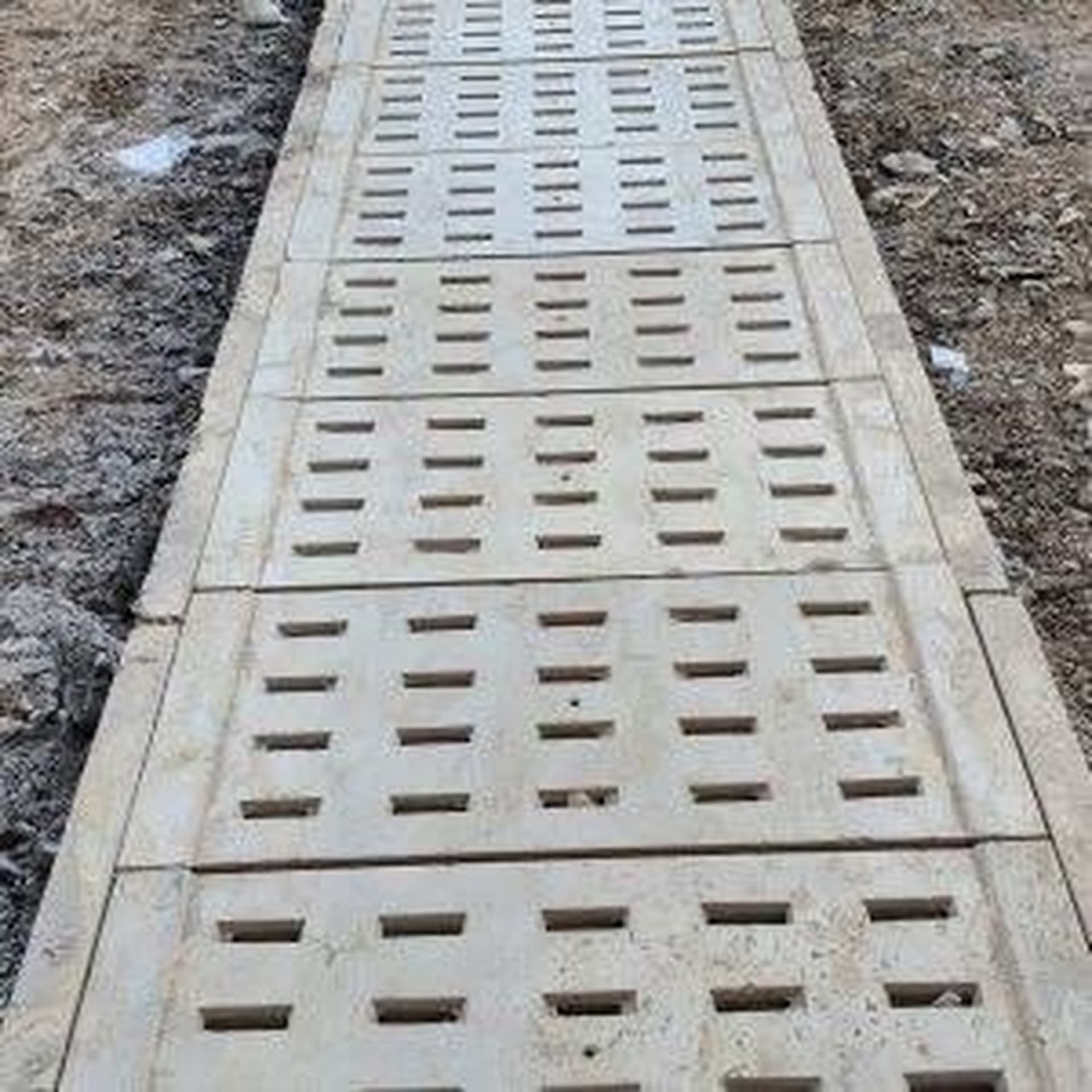 Perforated covers on a drainage run